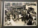 a black and white photo of a crowd of people
