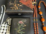 a lot of jewelry that is laying out on the table