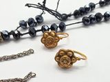 several pieces of jewelry are displayed on a white surface
