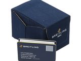 blue business card holder with a credit card in front of a blue box
