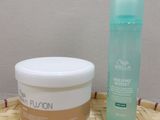 a bottle of lotion and a container of lotion sitting on a table