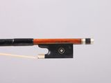 a violin bow with a wooden handle on a white background
