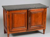 a wooden cabinet with two doors and a black granite top