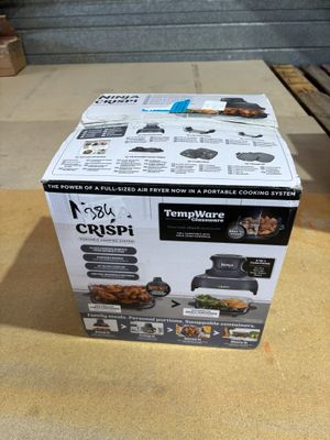 a box of food sitting on a table in a room