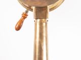 a clock that is on top of a pole