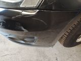 a close up of a car with a denting on the front of it
