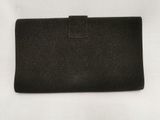 a black purse with a small zipper on the front