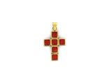 a gold cross pendant with red stones on a white background