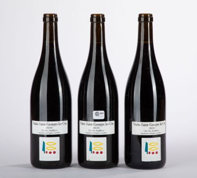 three bottles of wine sitting next to each other on a table