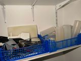 a blue basket filled with assorted items on a shelf