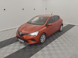 the orange car is parked in the garage on a checkered floor