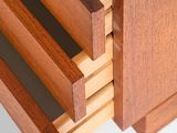 a close up of a wooden drawer with three drawers