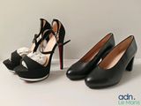two pairs of black high heel shoes with bows on them