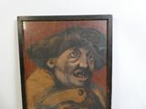 tableau représentant un homme moustachu et coiffé d'un chapeau, accroché au mur