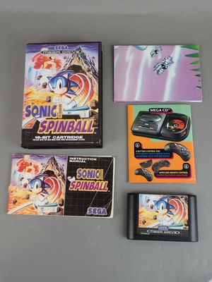 several video games on a table with a game controller
