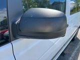 an image of a side view mirror of a van