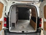 a white van with a bed in the back of it