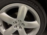 a close up of a tire on a car ' s rim