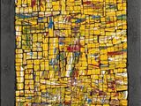une peinture abstraite composée de carrés jaunes et rouges sur fond noir