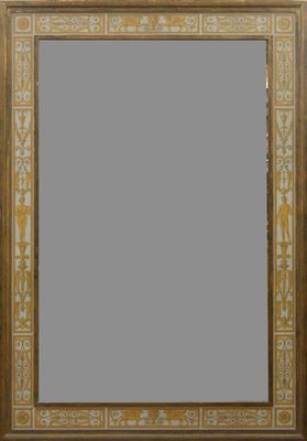 un cadre ancien en bois orné d'un motif doré et blanc