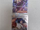 two pokemon trading cards in plastic bags on a table