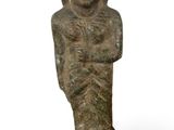 an ancient statue of a woman with a head and hands on her chest