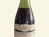 a bottle of wine that is sitting on a table