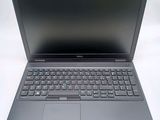 a laptop that is sitting on a white surface