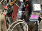 an image of a welding machine in a garage