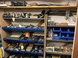 many shelves with various tools on them in a room