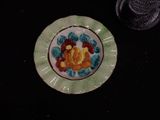 a small plate with flowers on it on a table