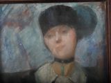 painting of a woman in a black hat with a blue background