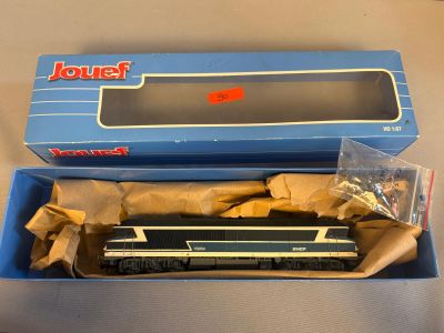 a blue box with a train in it on a table