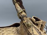 an image of a snake skin handbag with a leather strap