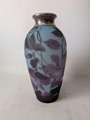 a vase that has a purple and blue design on it
