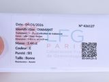 a person holding a white business card with a qr code on it