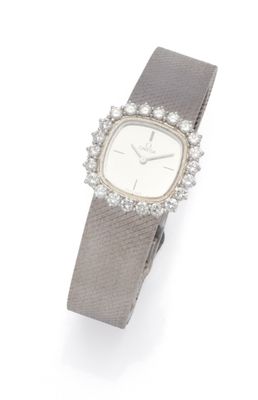 a lady ' s wrist watch with diamonds and a leather band
