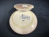 a white plate with a picture on it sitting on a table