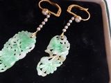 pair of green jade and pearl earrings in a gift box