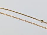 a pair of gold chains on a white background