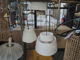 a lot of lamps that are hanging from the ceiling