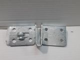 a close up of a pair of metal latches on a white surface