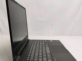 the back of a laptop computer sitting on top of a white surface