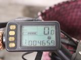 a close up of a motorcycle with a clock on the handlebars