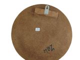 a picture of a brown hat with a tag on it