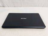 an open laptop computer sitting on top of a white surface