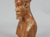 an image of a wooden sculpture of a man ' s head