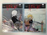 two comics are on display on a table in front of a white background
