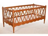 a wooden baby crib with a wooden frame on it