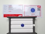 a picture of a mailbox with a blue button on it